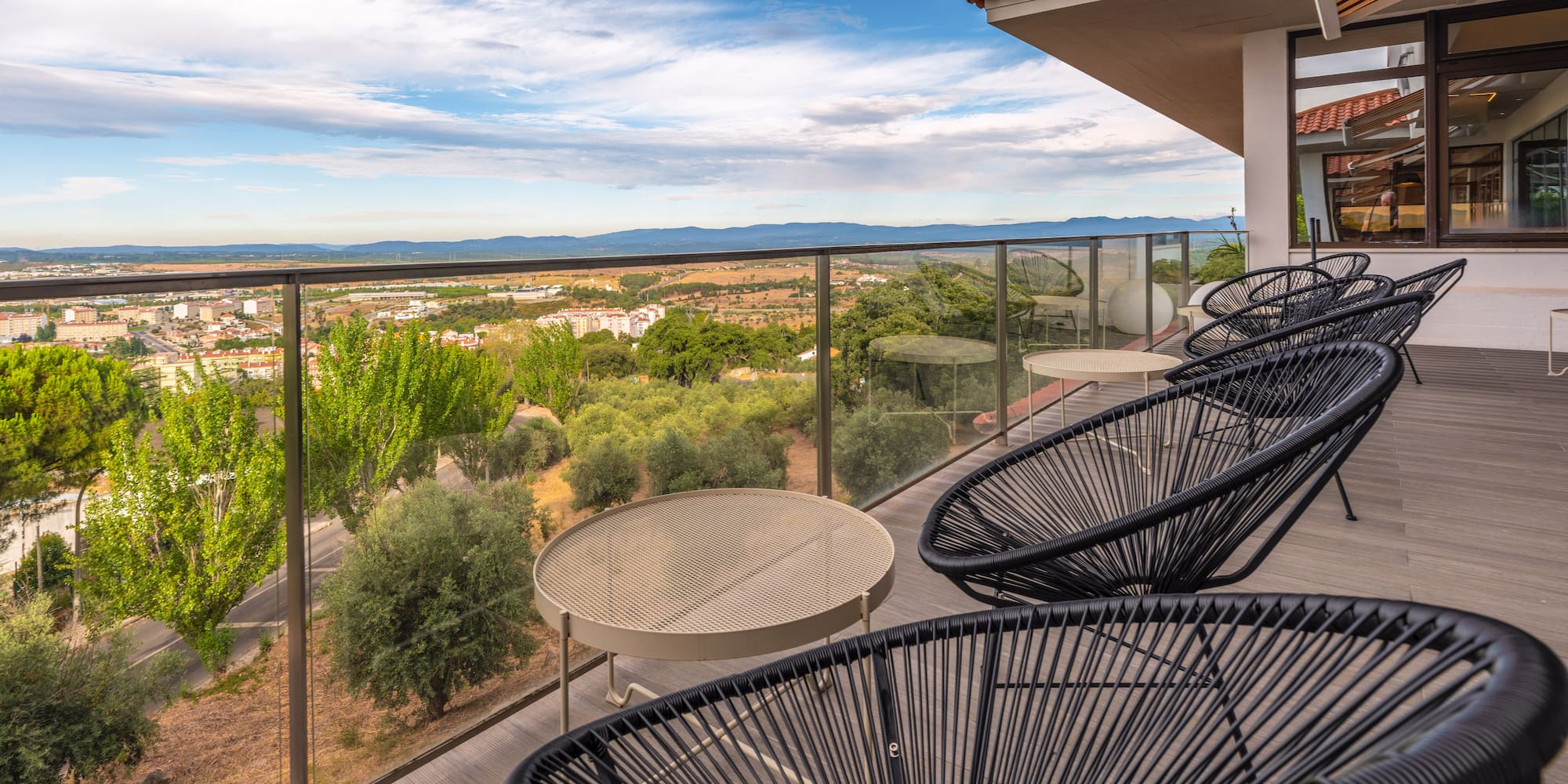a patio with chairs and a table