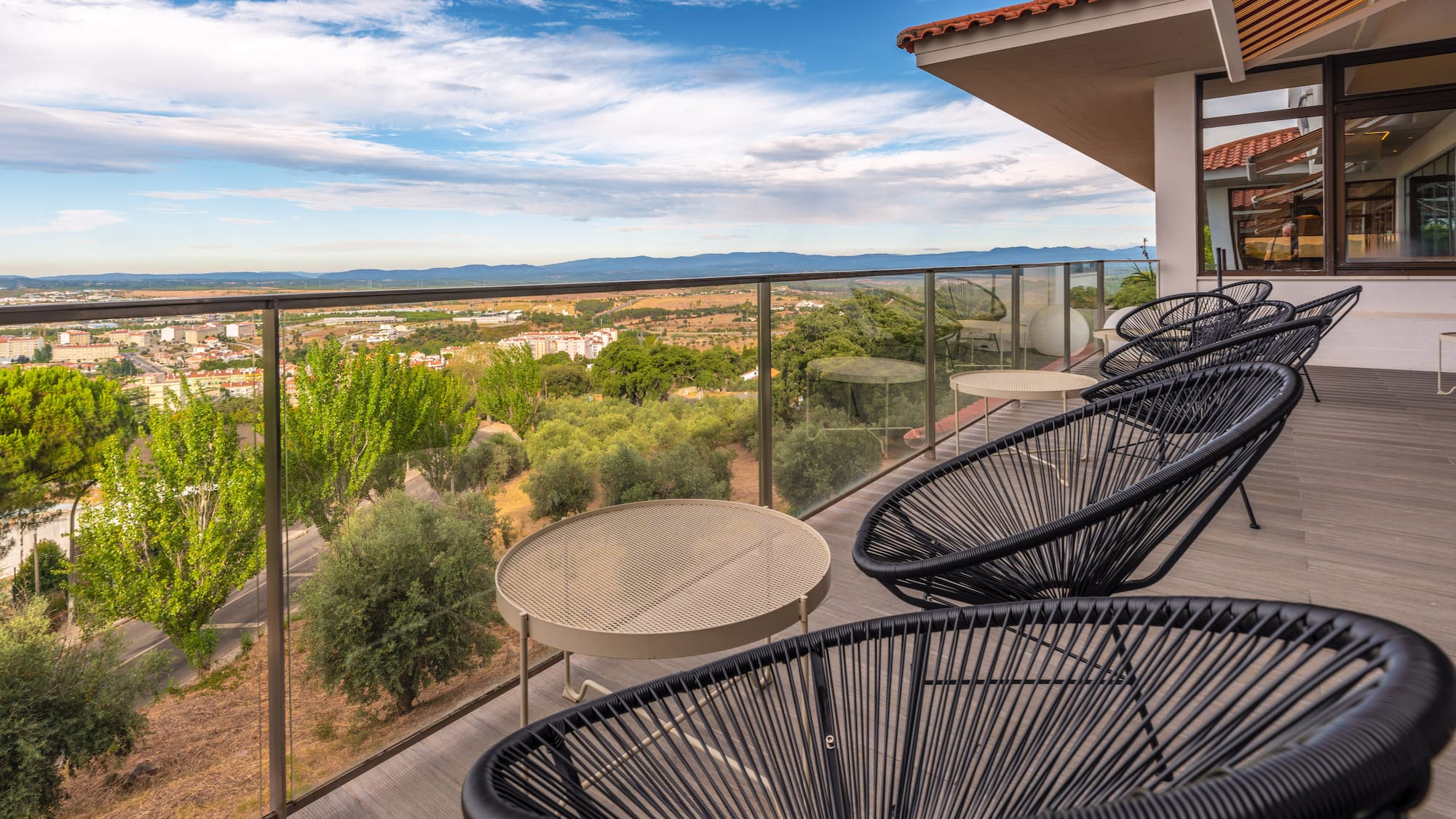 a patio with chairs and a table