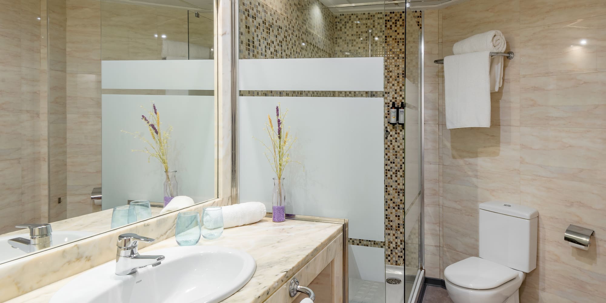 a bathroom with a sink and shower