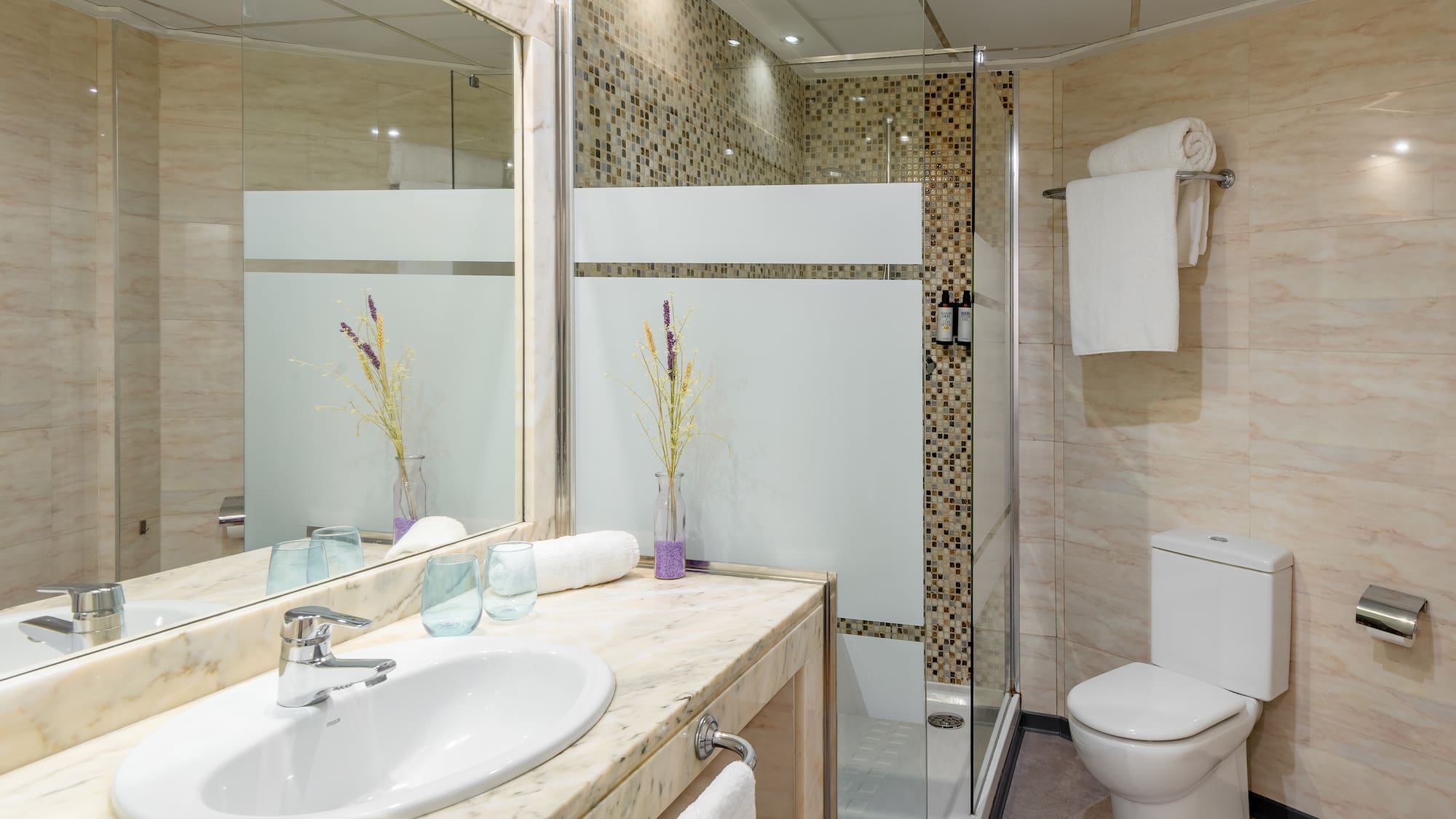 a bathroom with a sink and shower