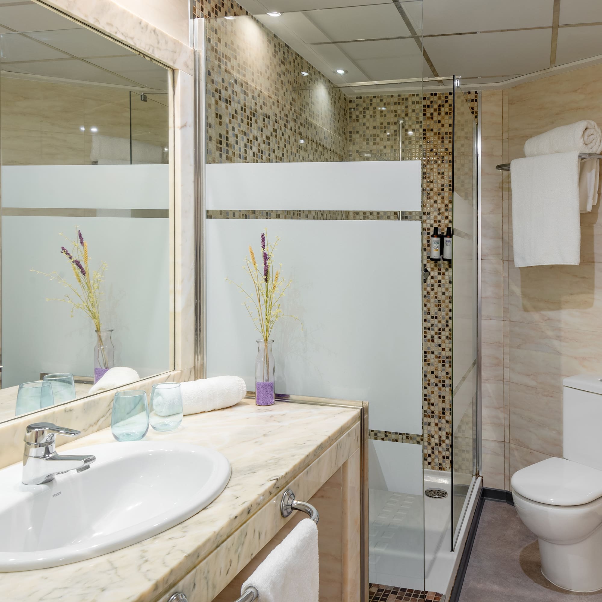 a bathroom with a sink and shower