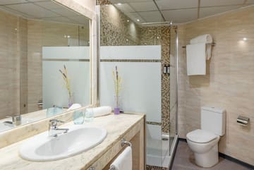 a bathroom with a sink and shower