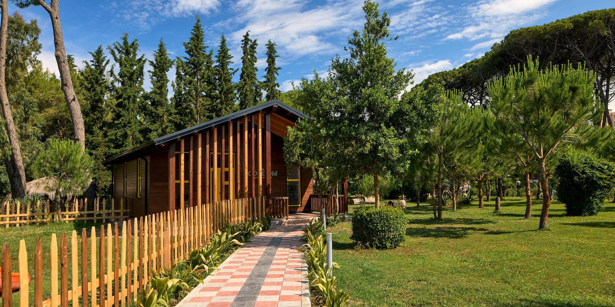 a house with a fence and grass