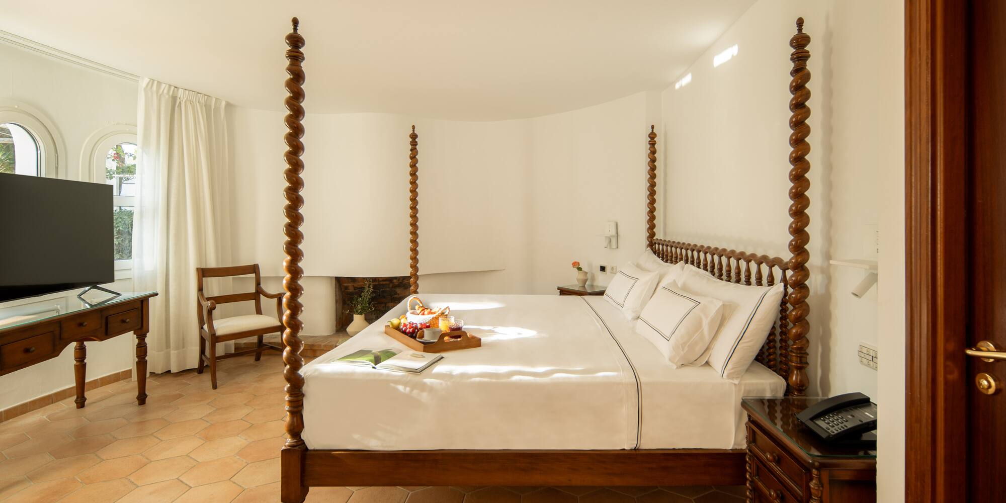 a bed with a tray of food on it