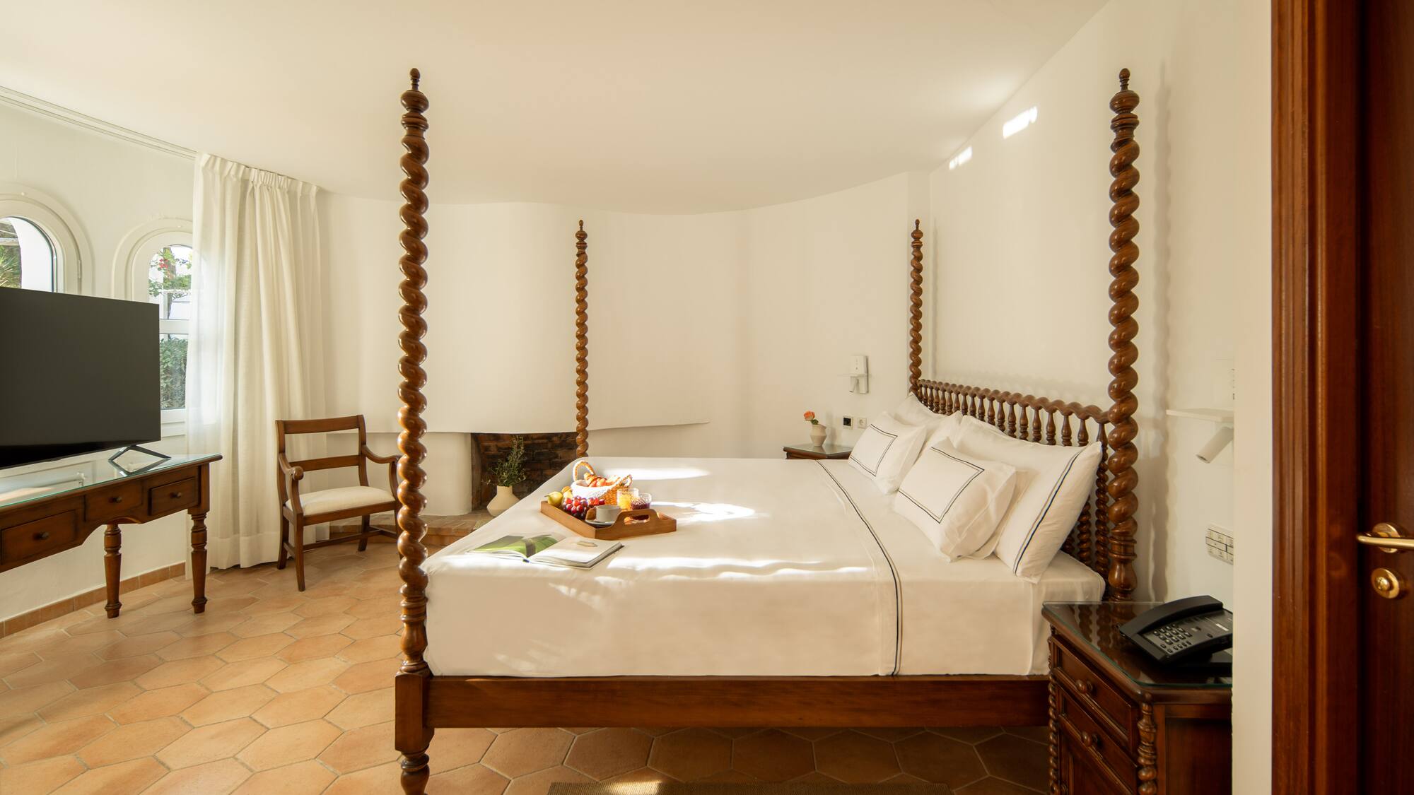 a bed with a tray of food on it