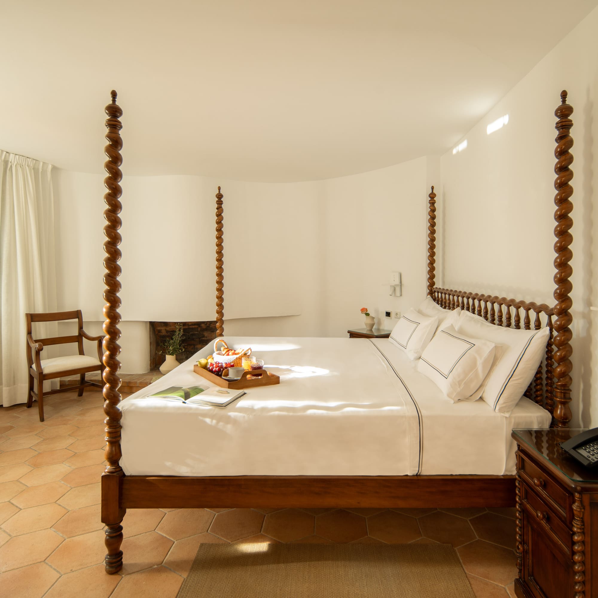 a bed with a tray of food on it