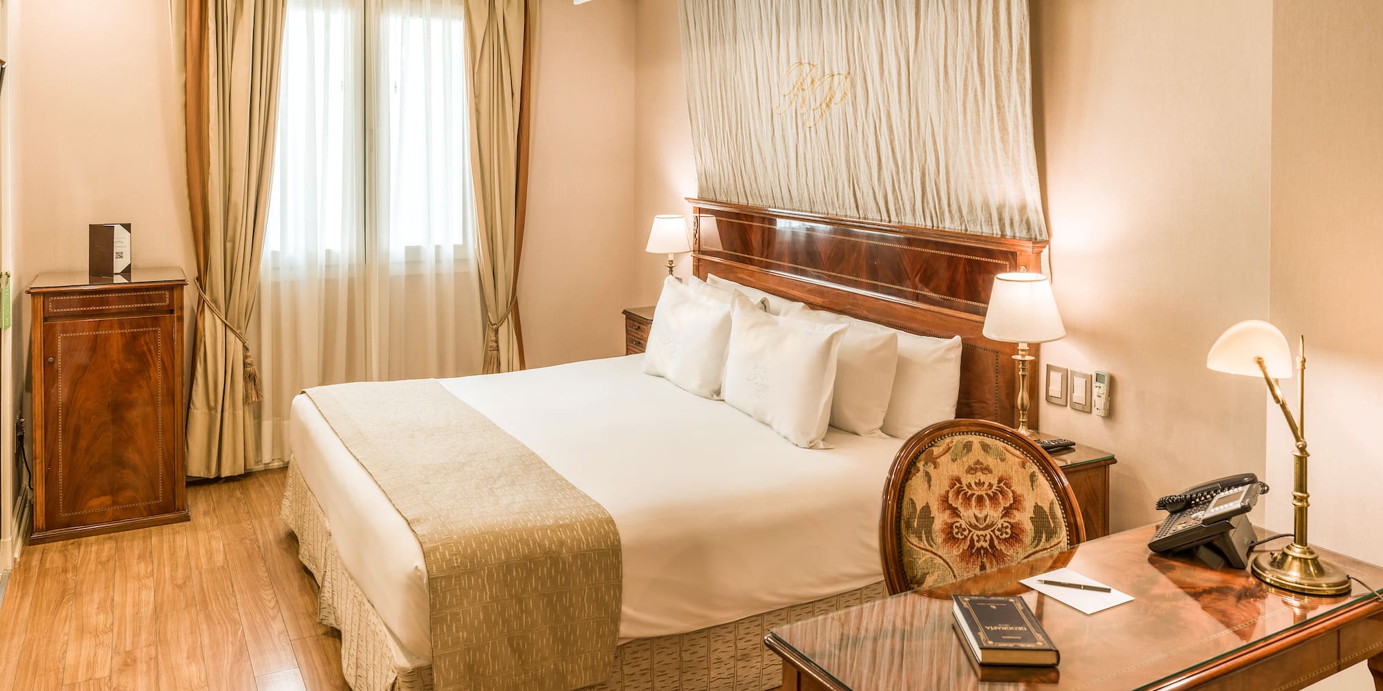 a room with a bed and a desk