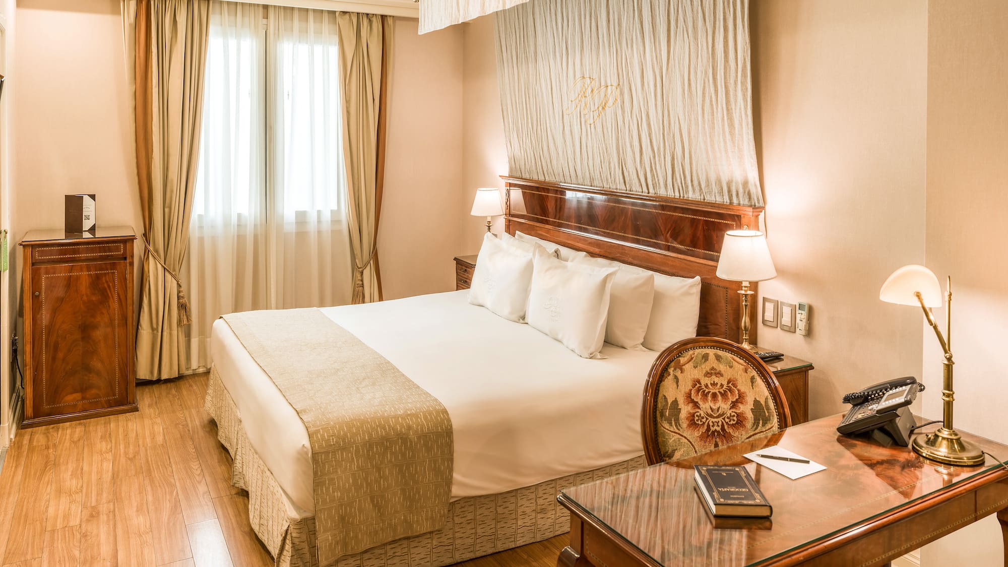 a room with a bed and a desk