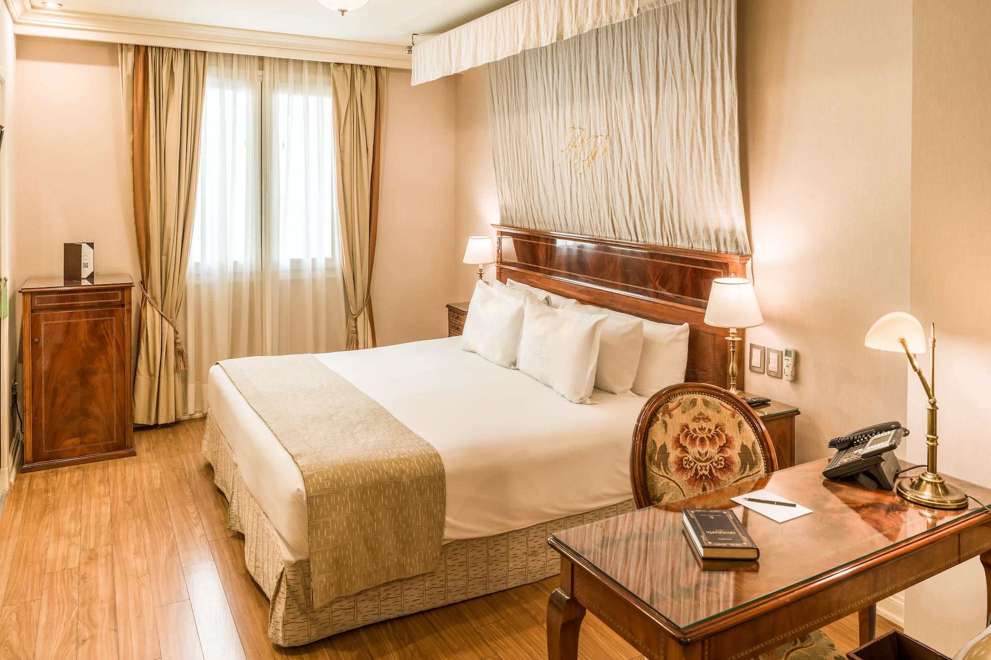 a room with a bed and a desk