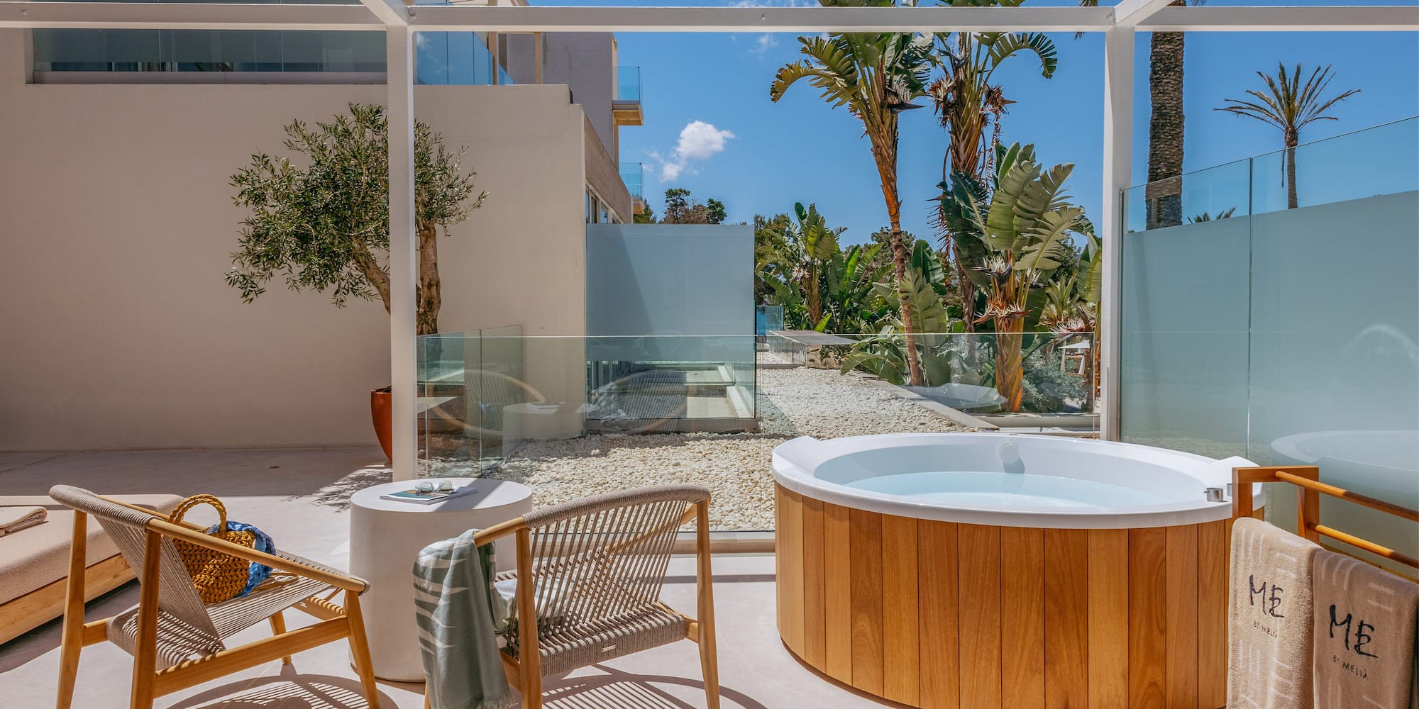 a hot tub and chair on a patio