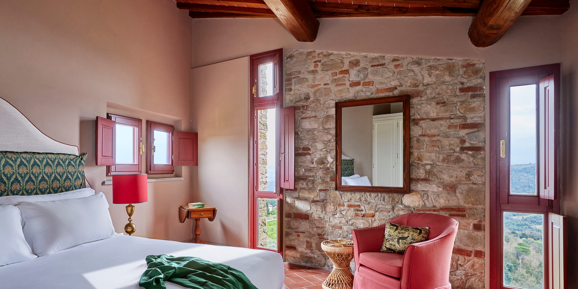 a bedroom with a bed and a chair