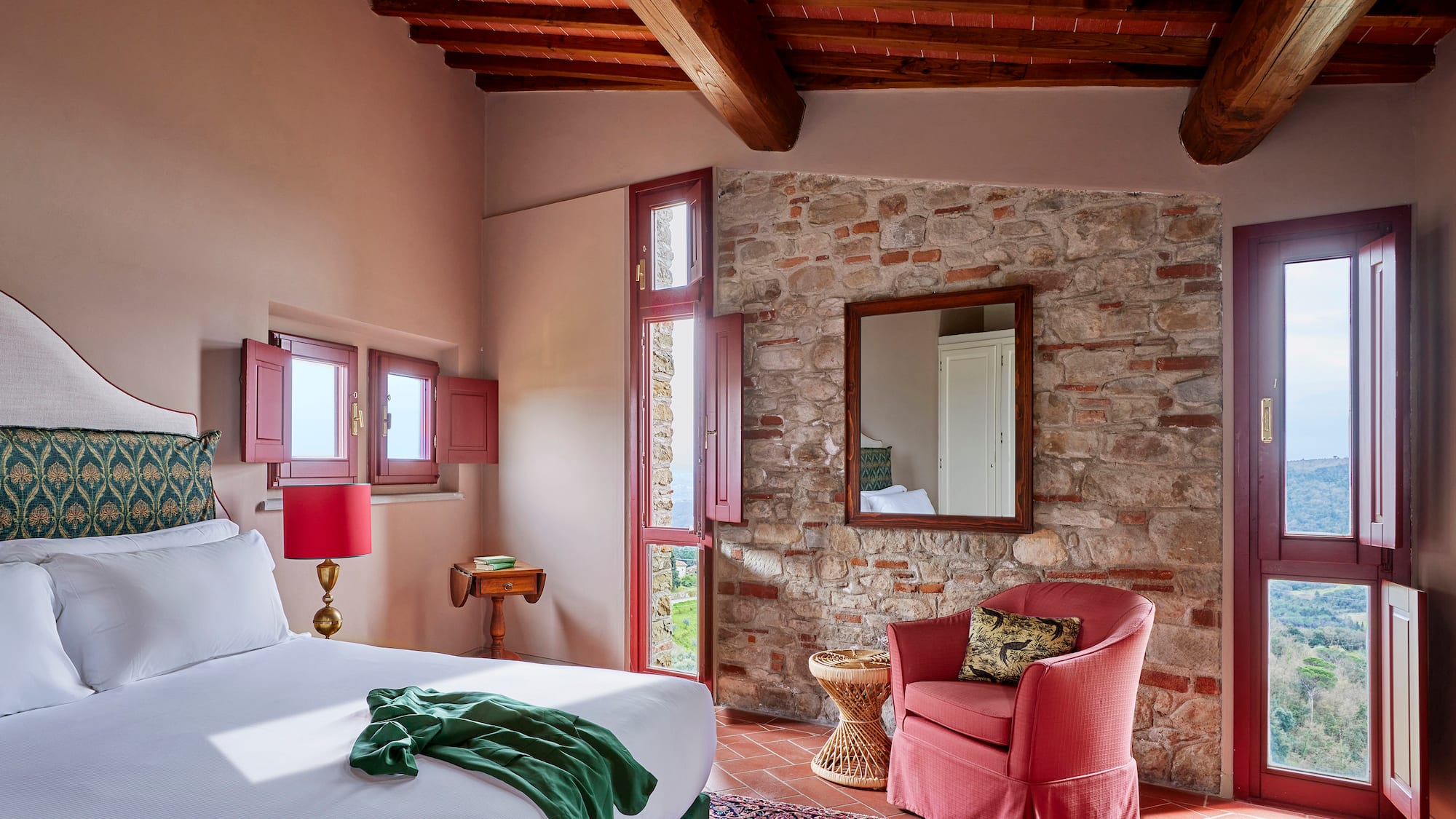 a bedroom with a bed and a chair