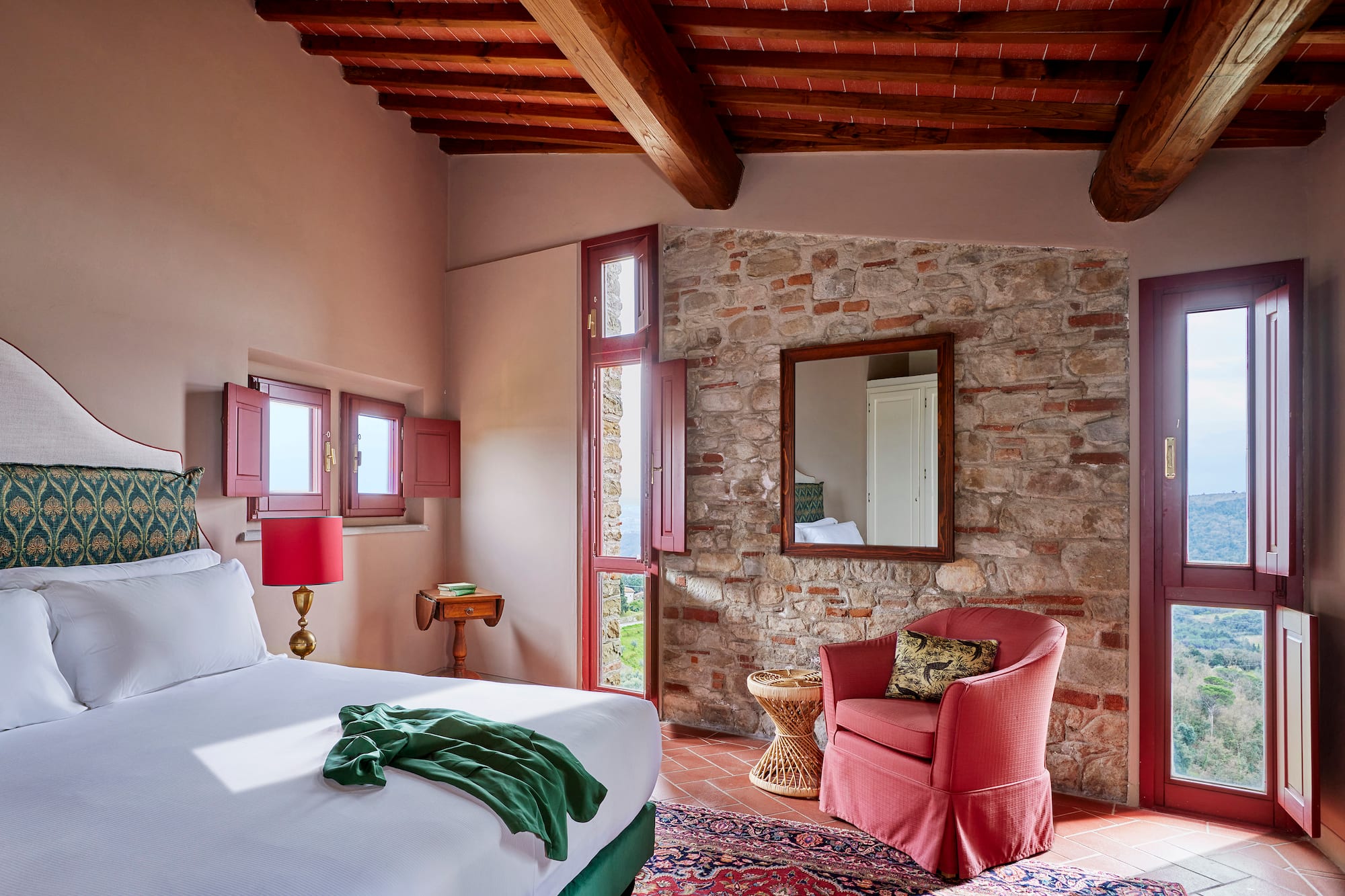 a bedroom with a bed and a chair