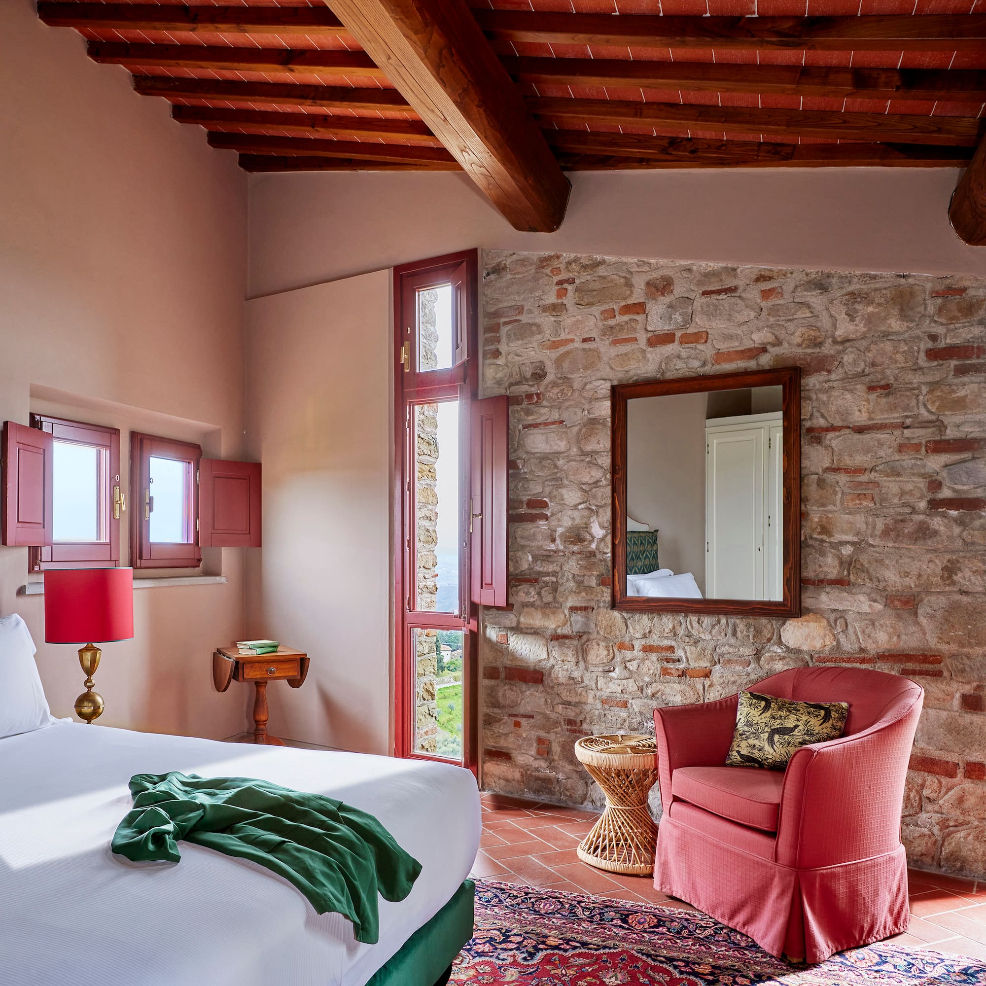 a bedroom with a bed and a chair