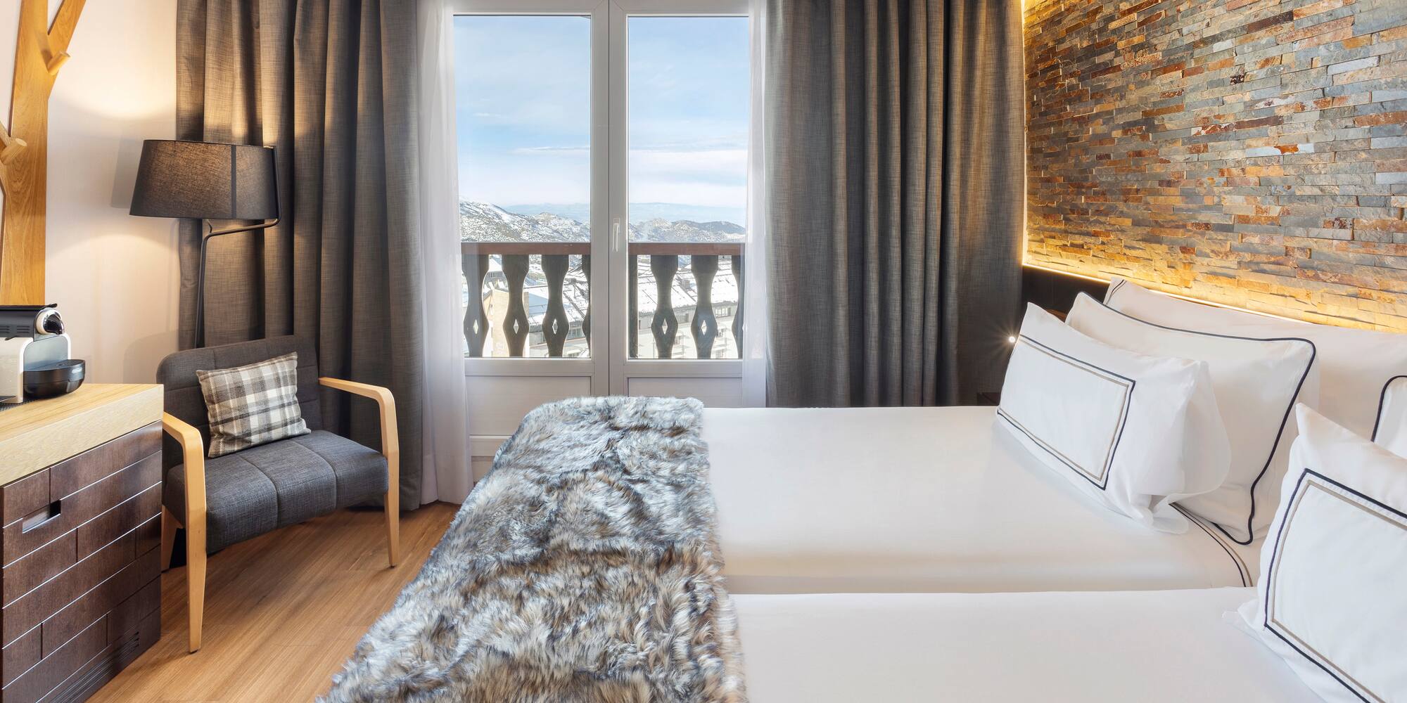 a room with a bed and a chair