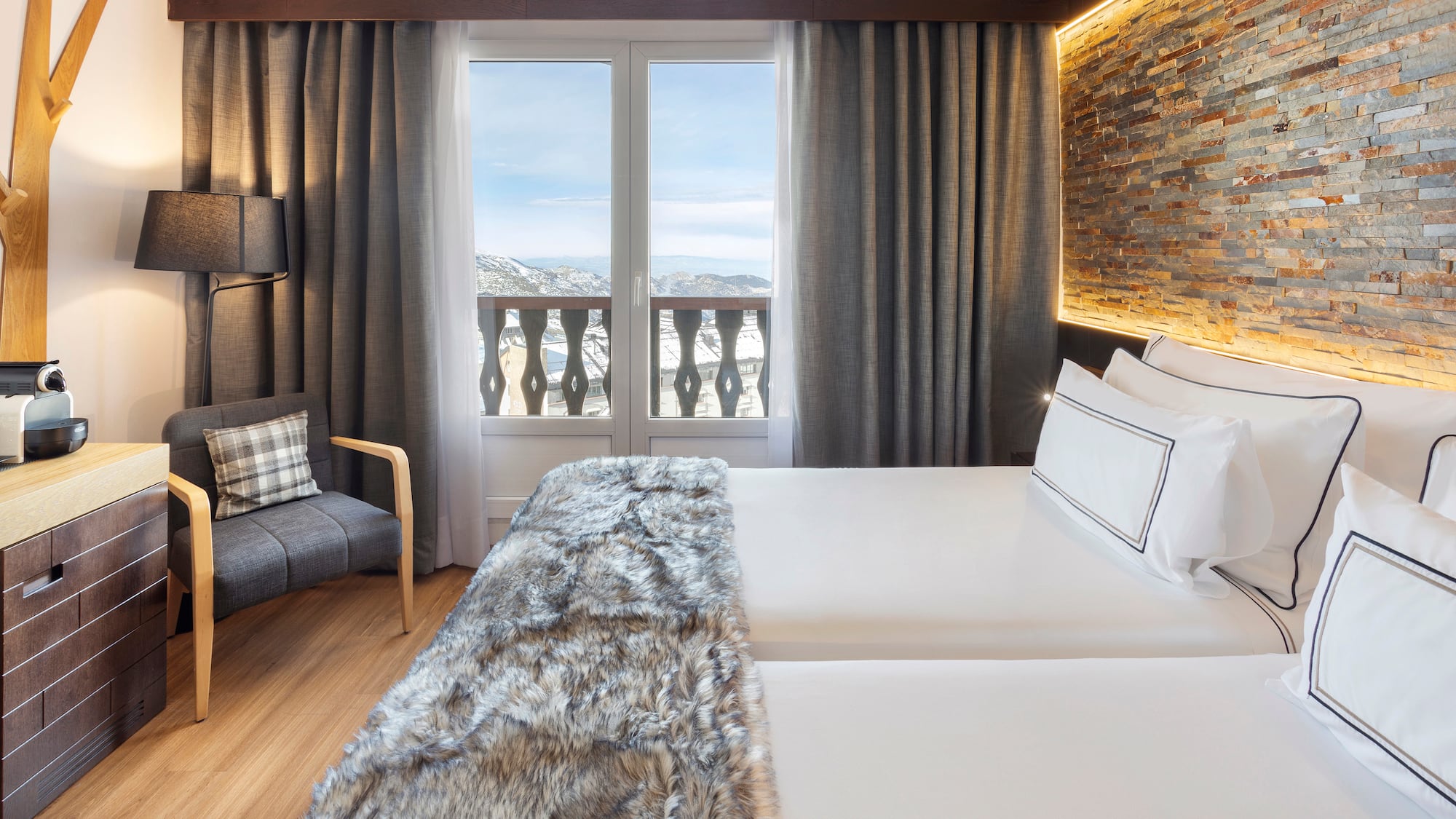 a room with a bed and a chair