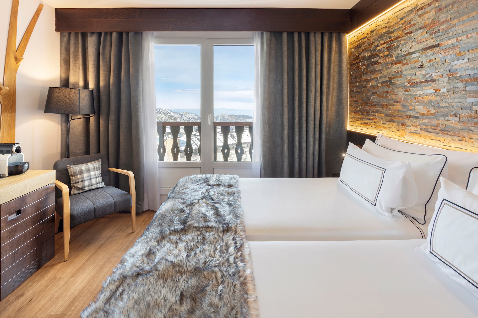 a room with a bed and a chair