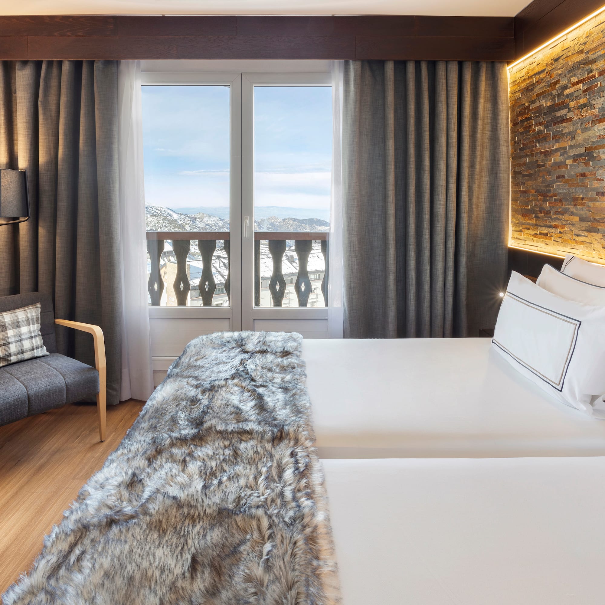 a room with a bed and a chair