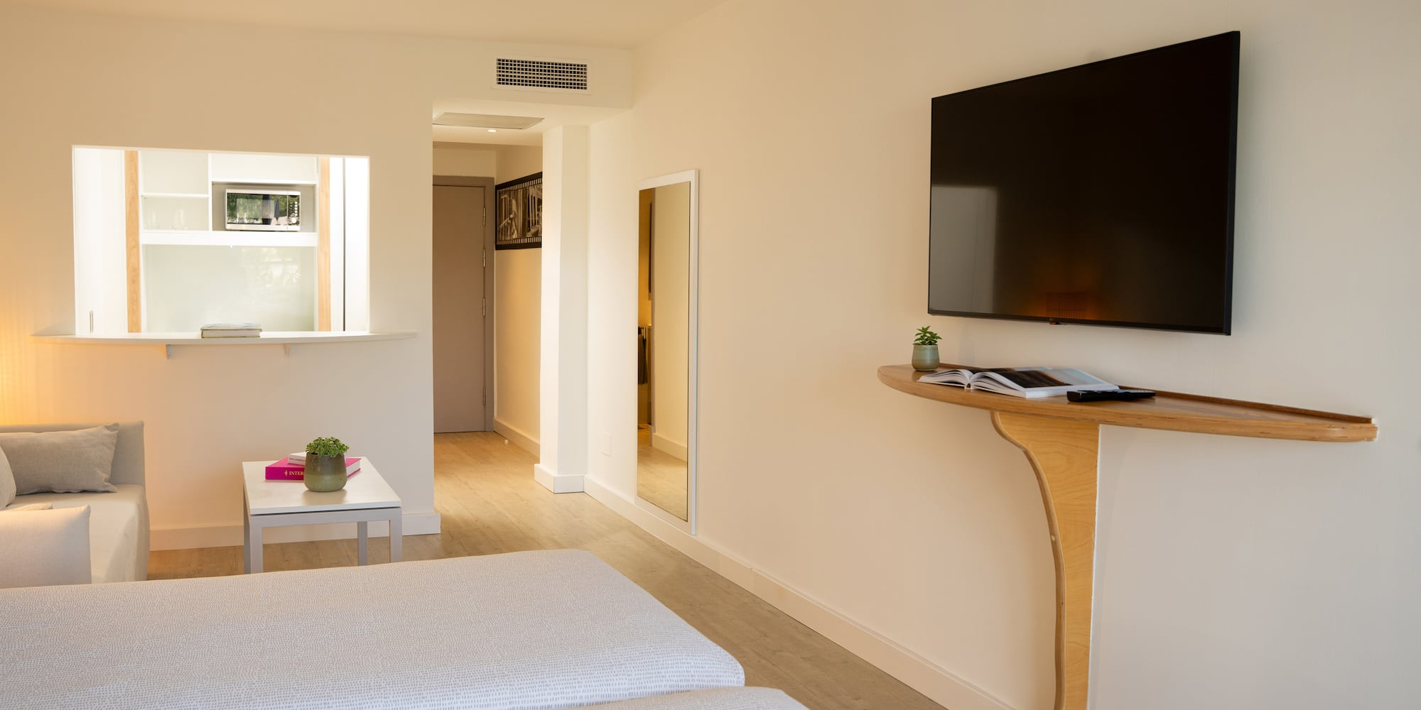 a room with a tv on the wall