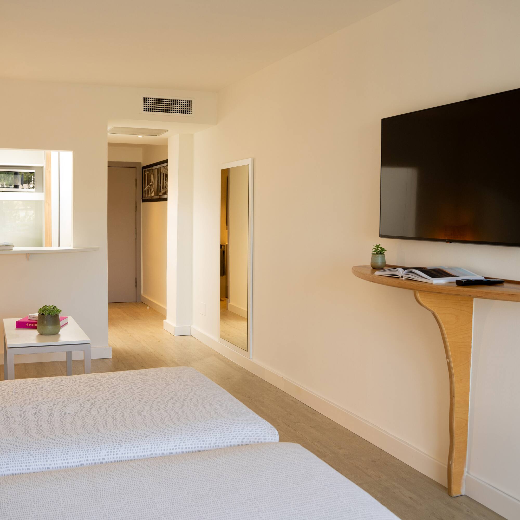 a room with a tv on the wall