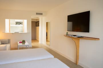 a room with a tv on the wall