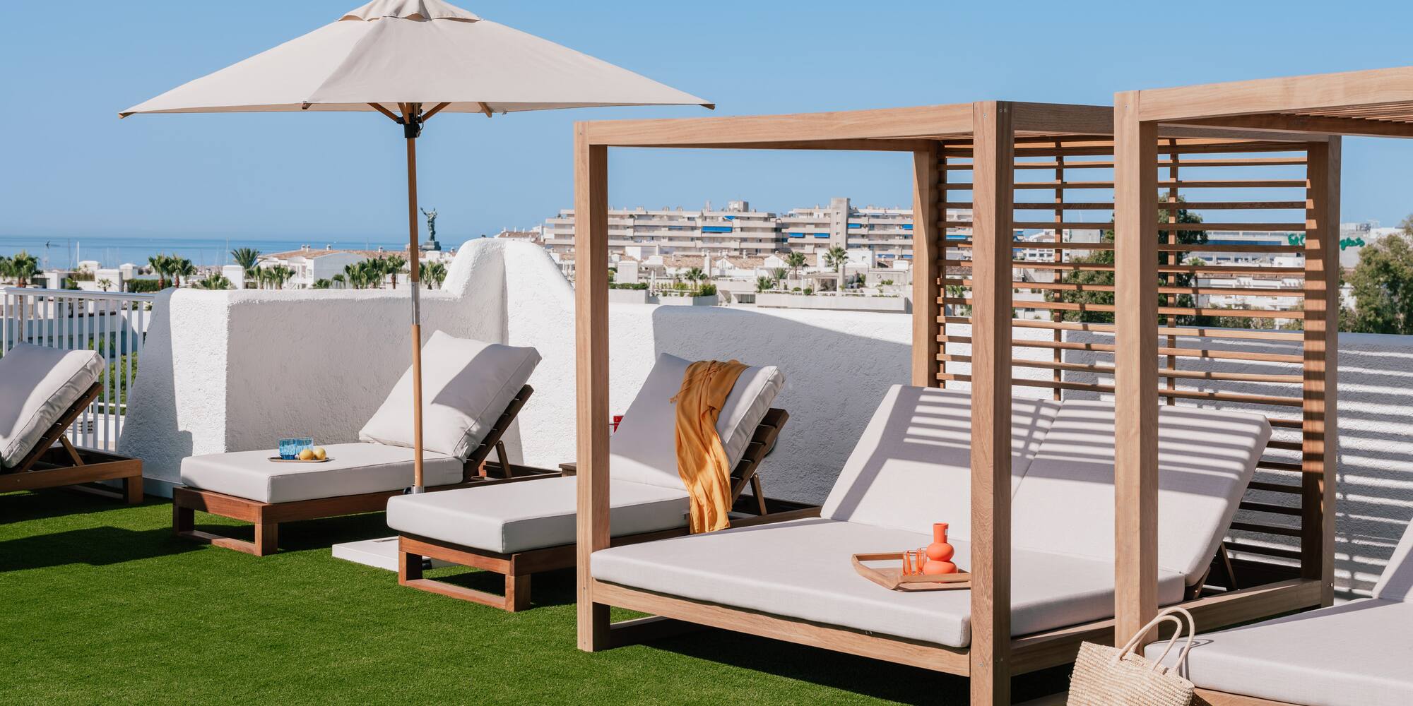 a group of lounge chairs on a lawn