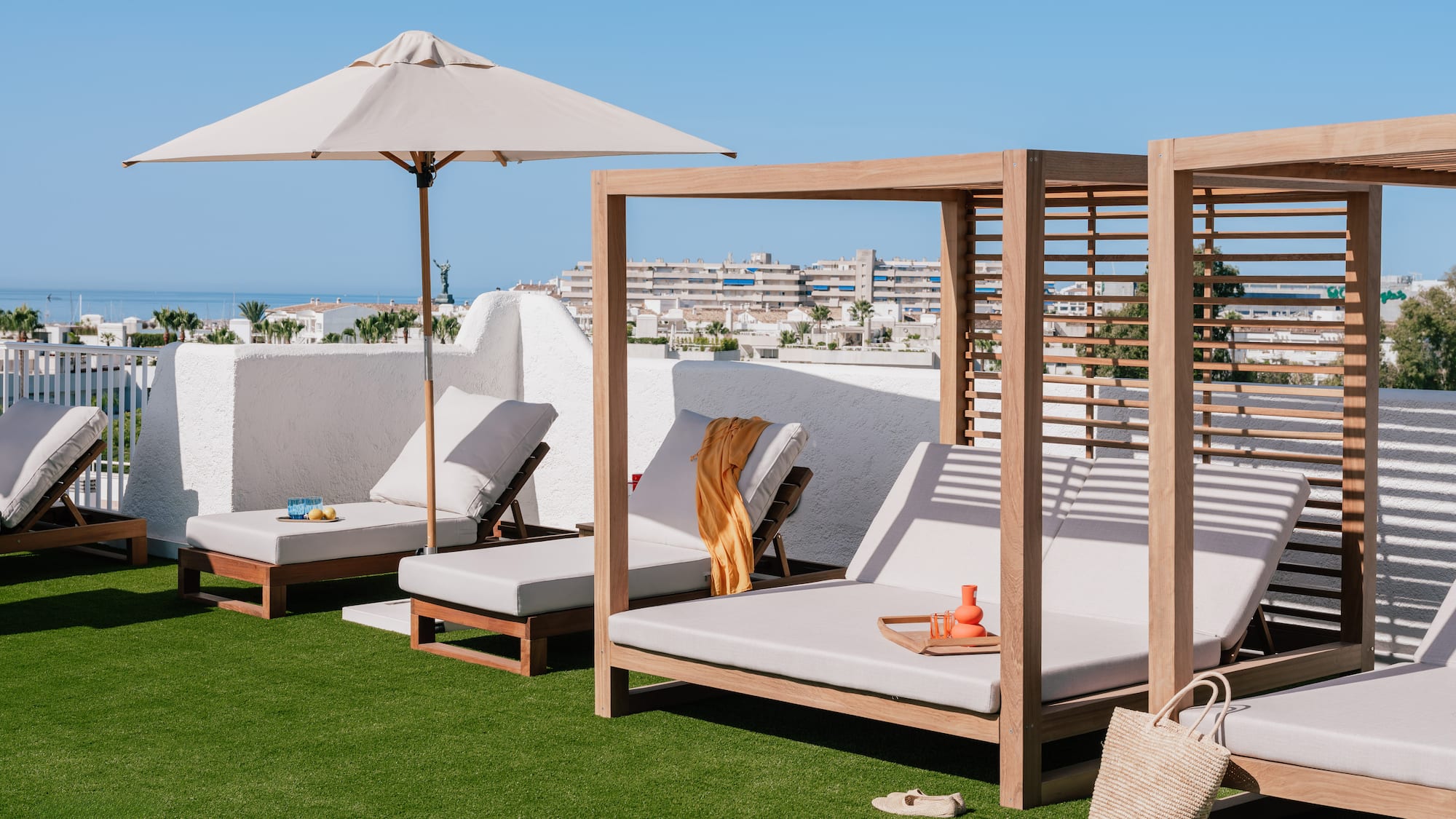 a group of lounge chairs on a lawn