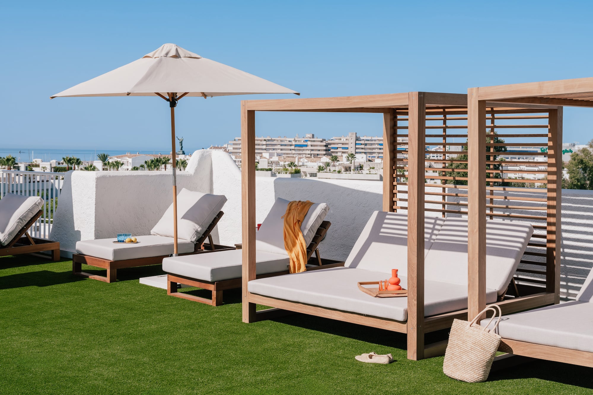 a group of lounge chairs on a lawn