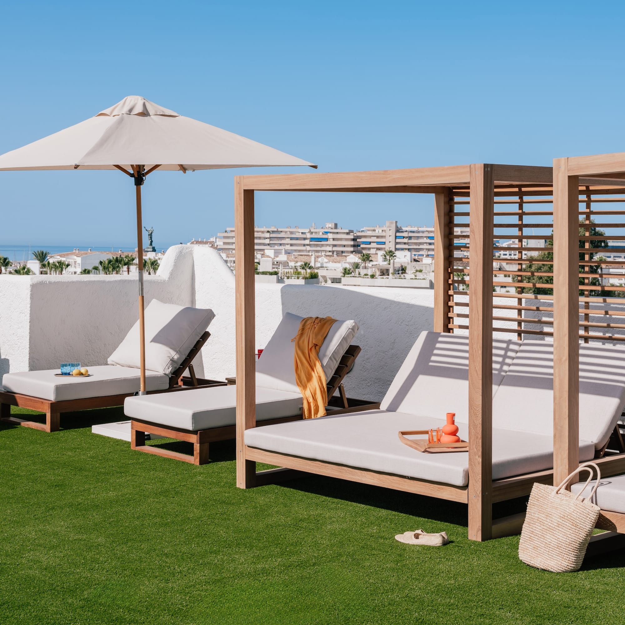 a group of lounge chairs on a lawn