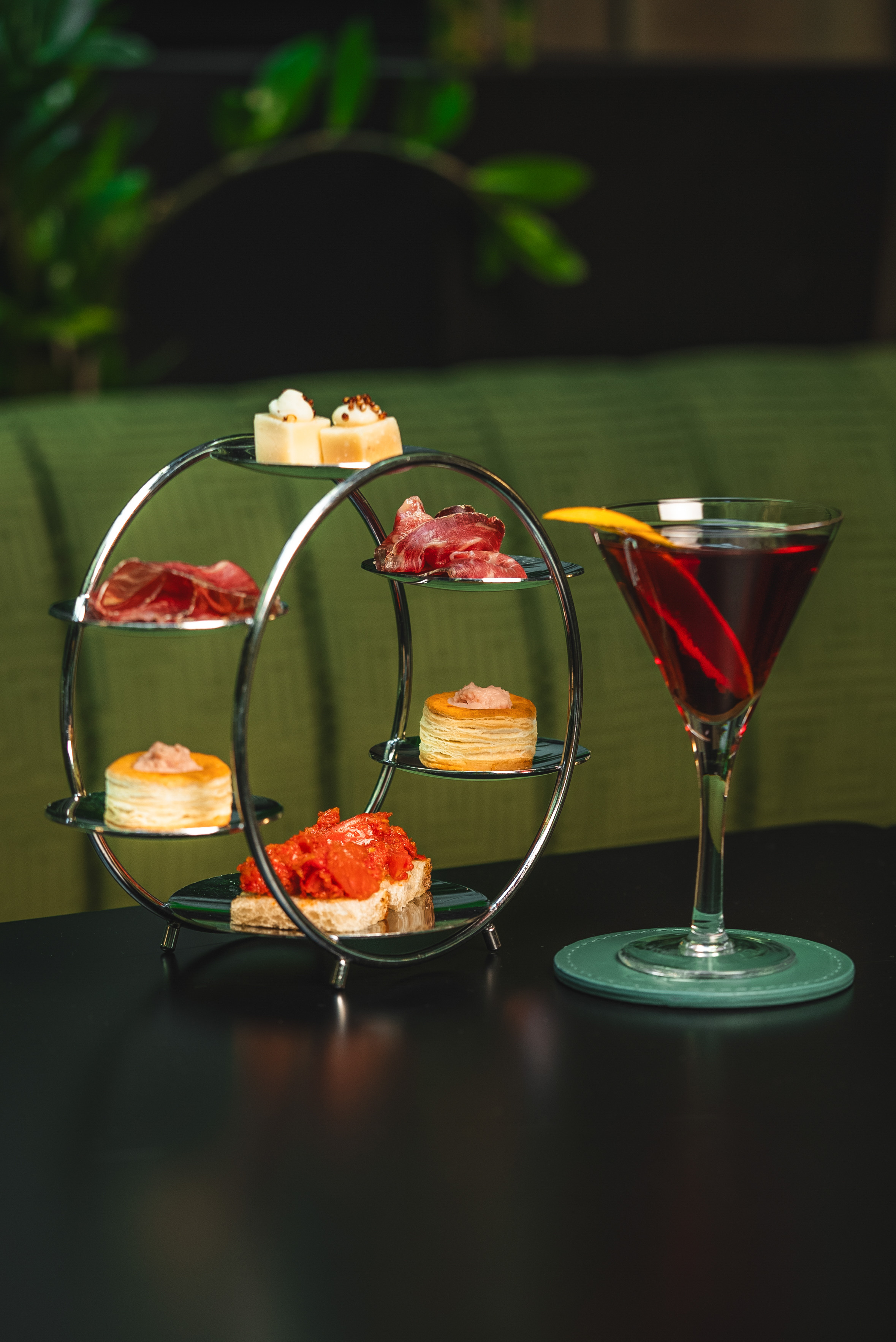 a glass of wine next to a plate of food