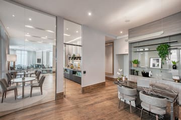 a room with a dining table and chairs