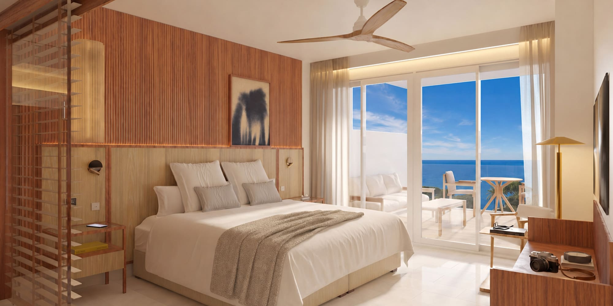 Coastal hotel room with ocean view balcony, king bed, and modern wooden decor.