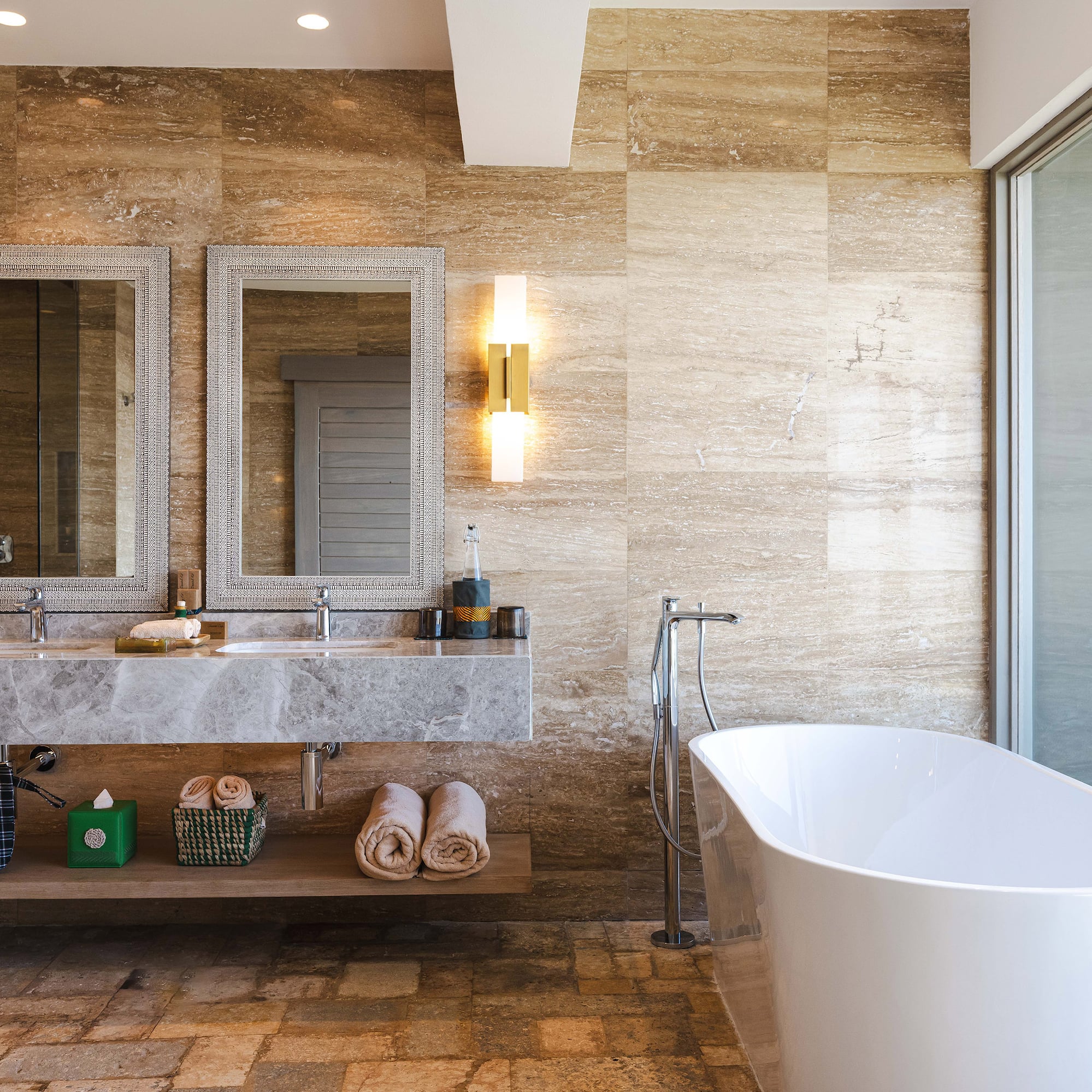 a bathroom with a tub and a sink
