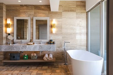 a bathroom with a tub and a sink