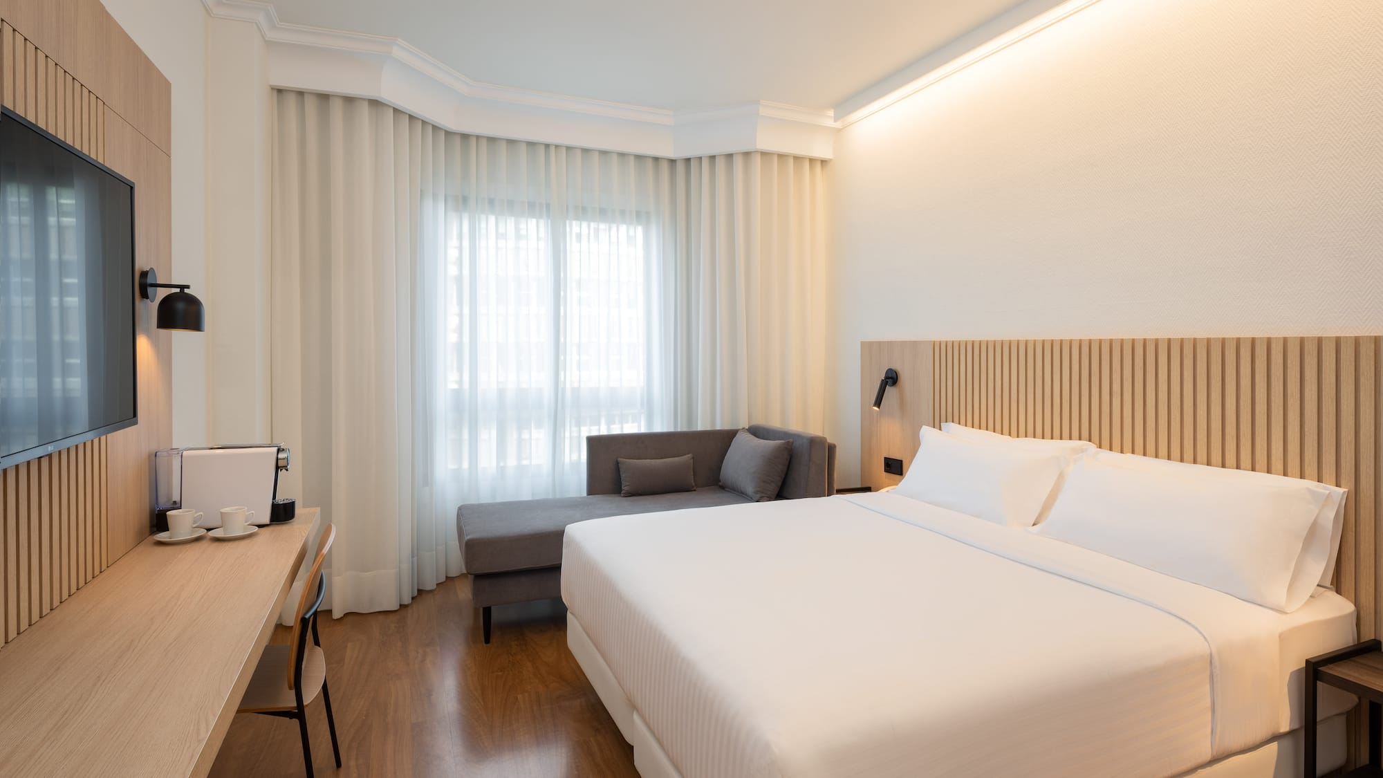 a room with a bed and a desk