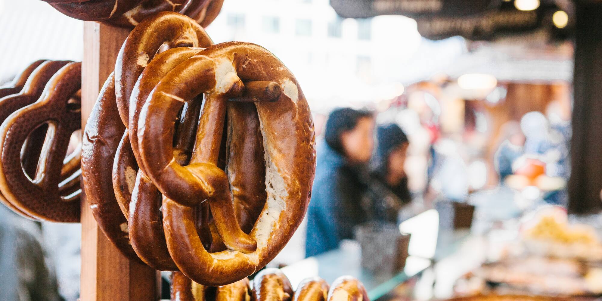 Bavarian pretzels hanging at a German street food market.