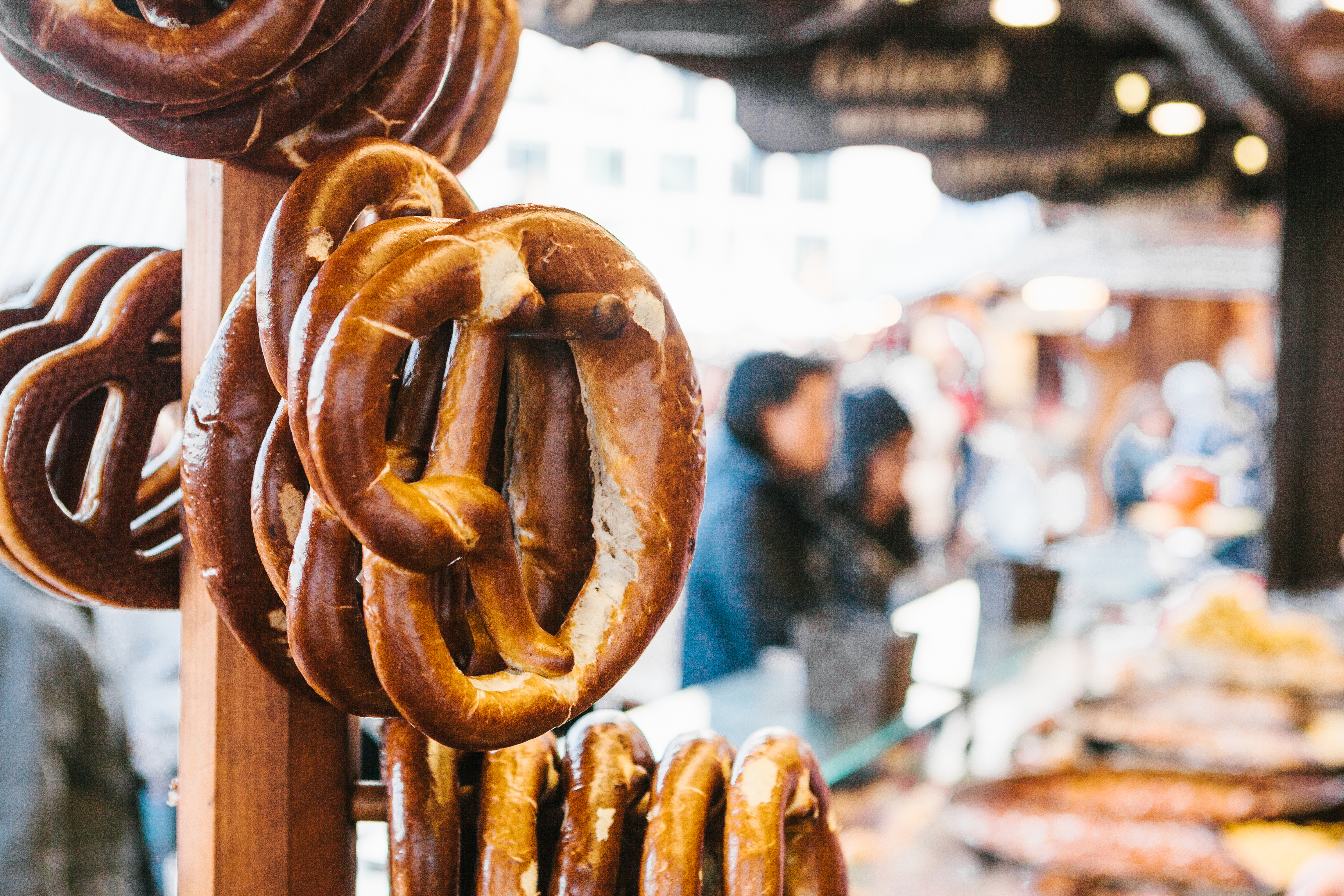 Bavarian pretzels hanging at a German street food market.