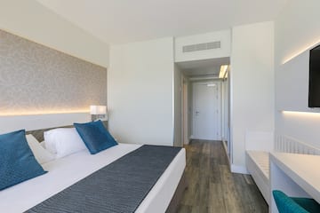 a bedroom with a bed and a door.