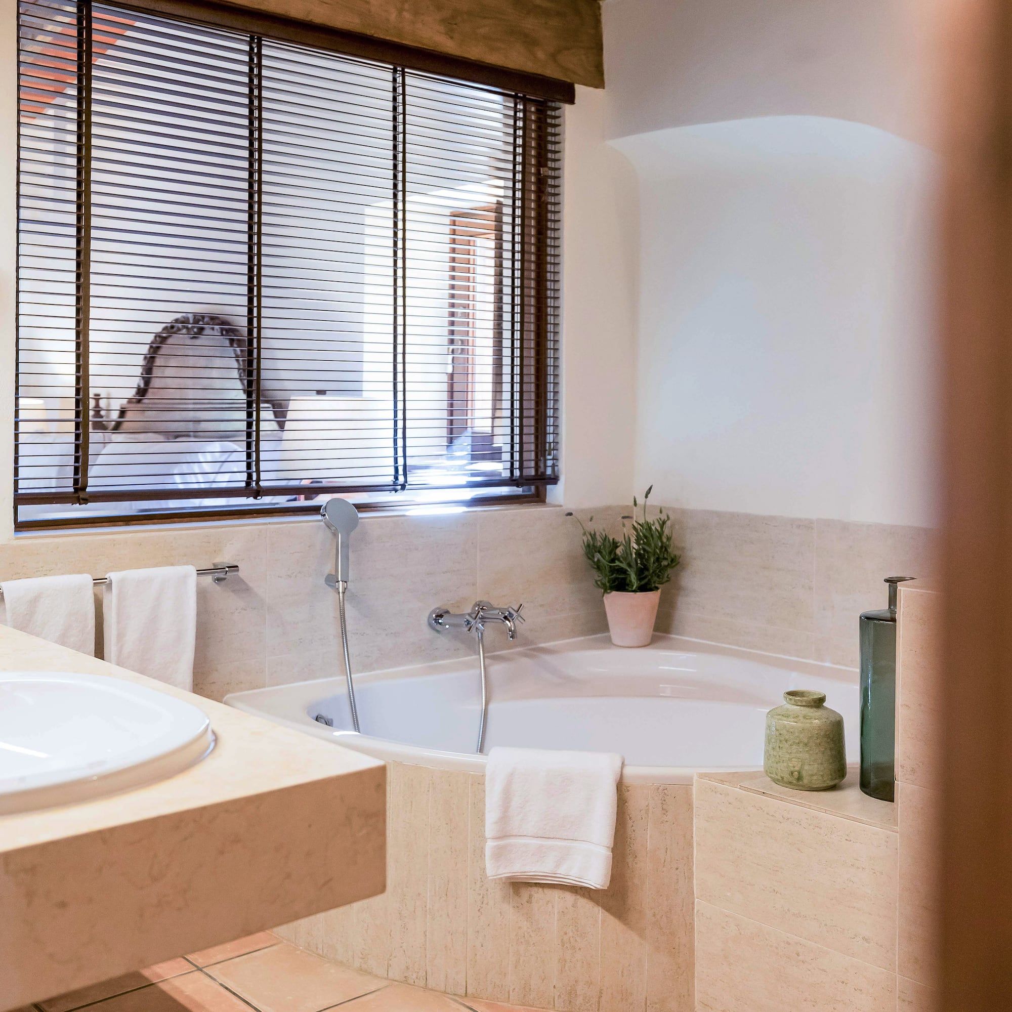 a bathroom with a tub and sink