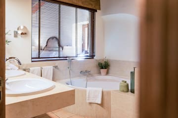 a bathroom with a tub and sink
