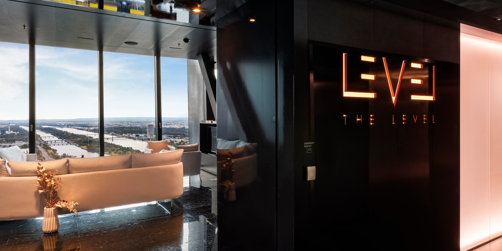 a room with a black wall and a white couch