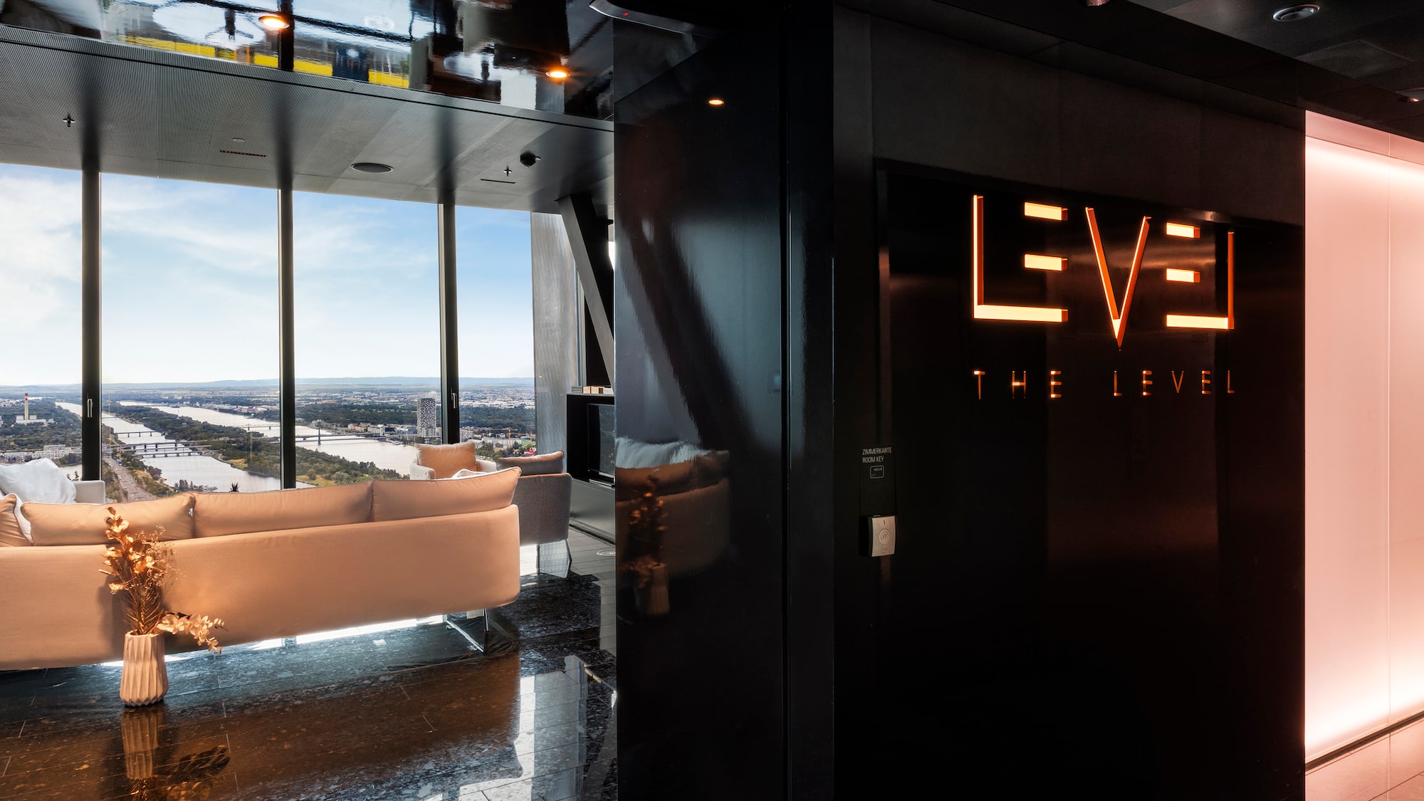 a room with a black wall and a white couch