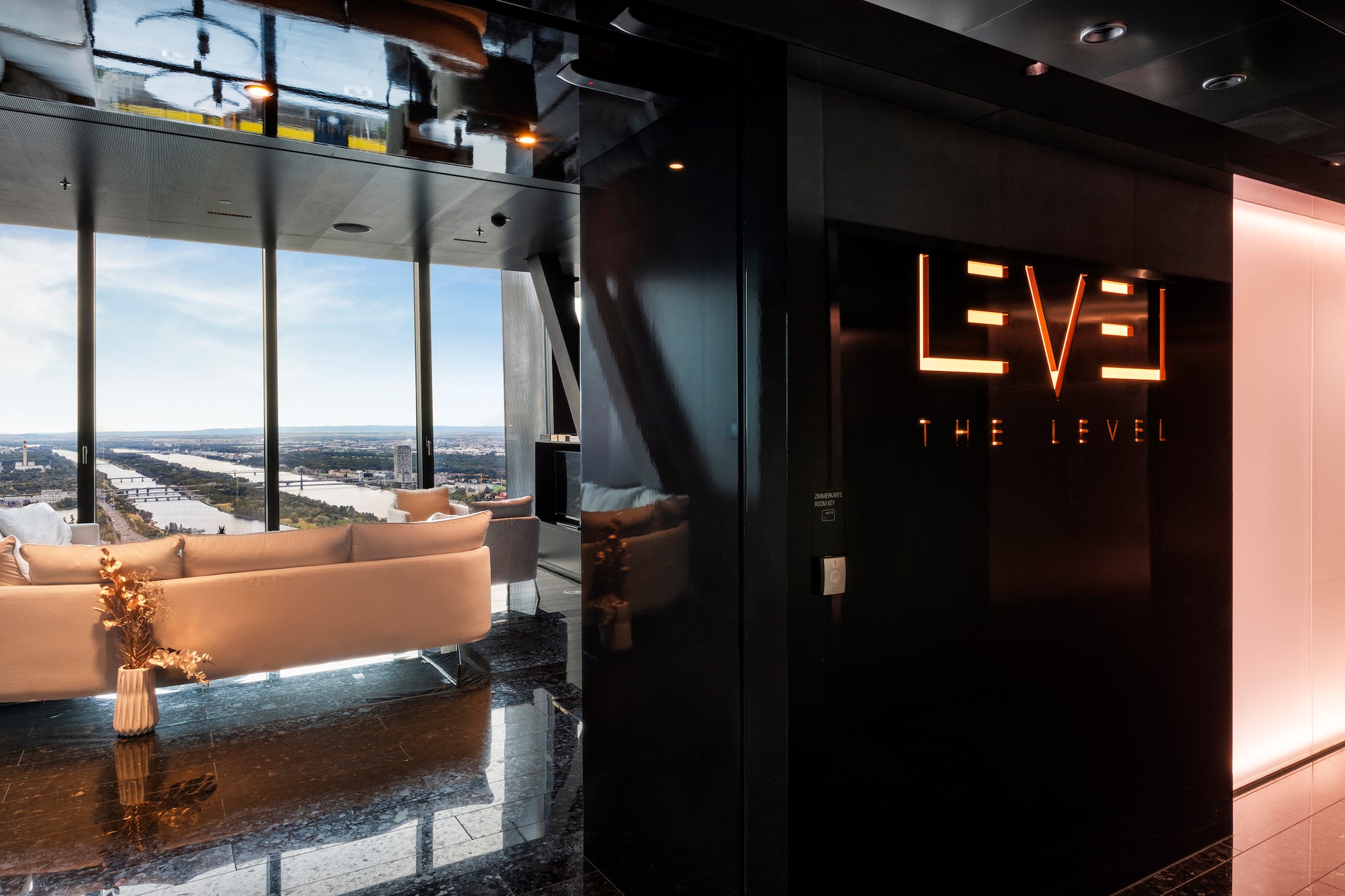 a room with a black wall and a white couch