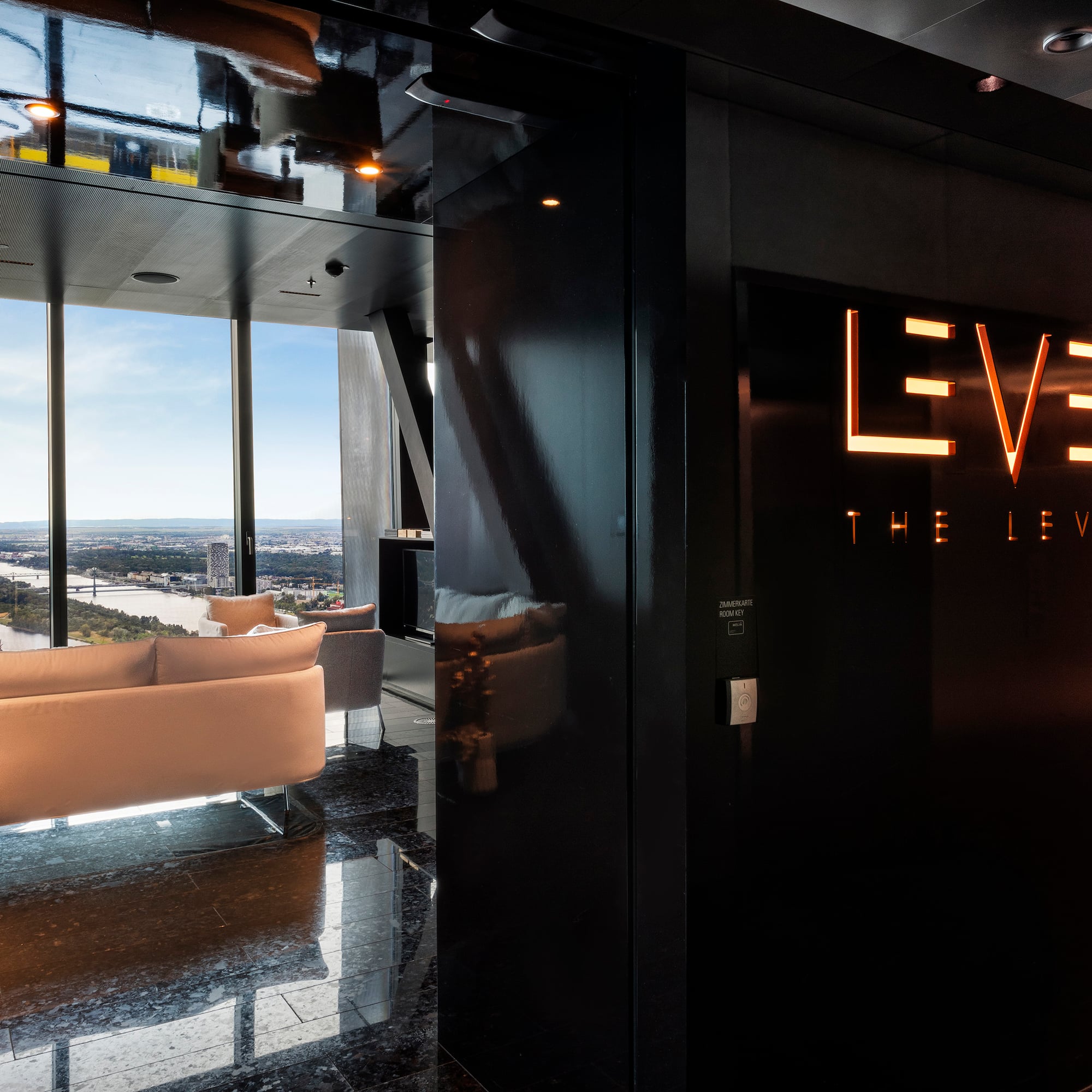 a room with a black wall and a white couch