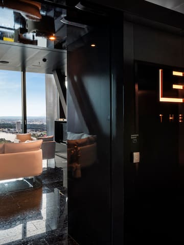 a room with a black wall and a white couch