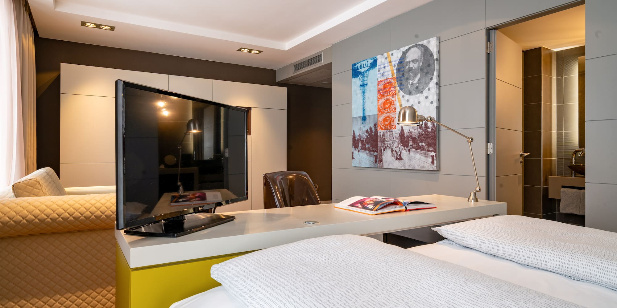 a room with a bed and a tv