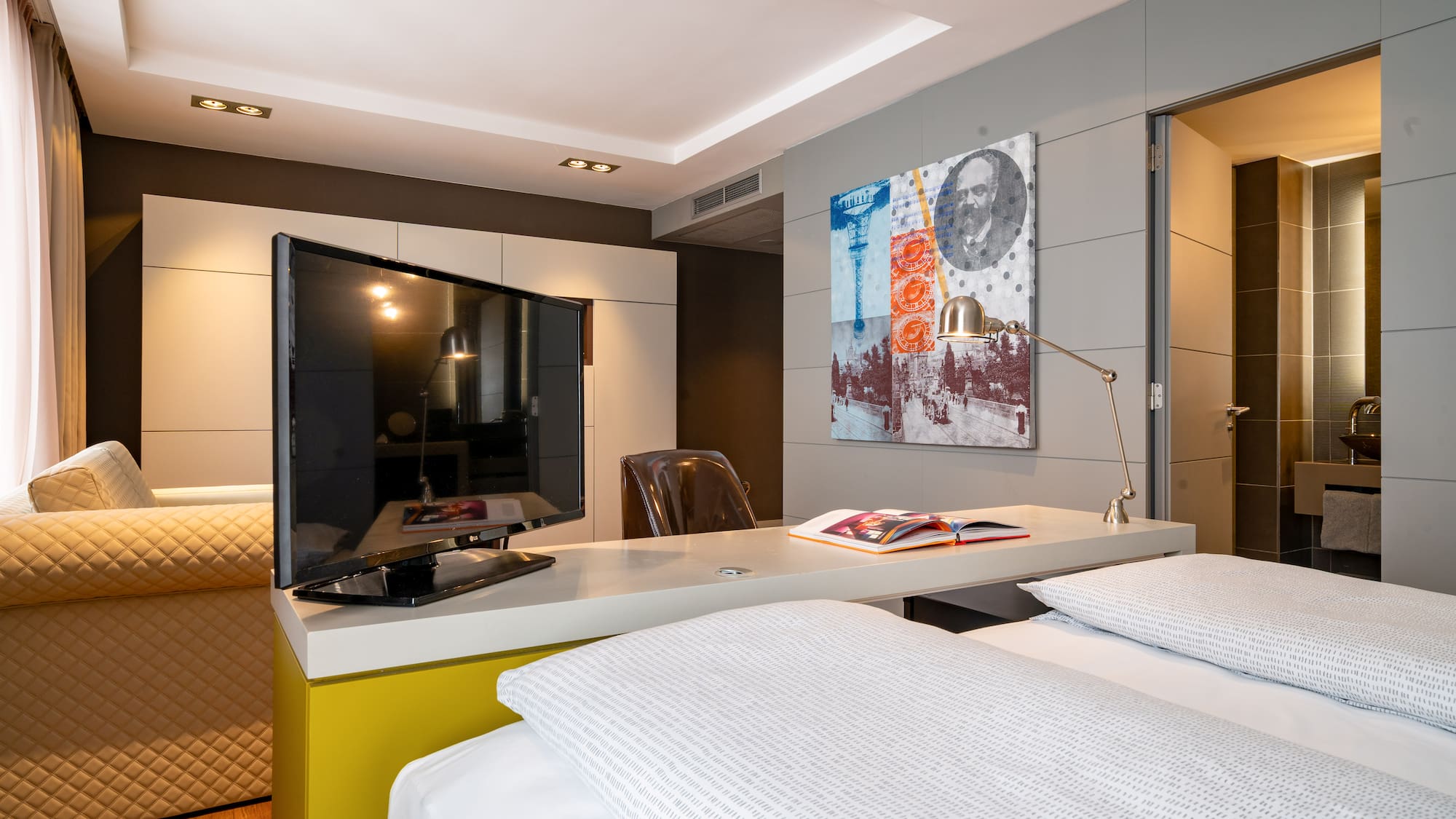 a room with a bed and a tv