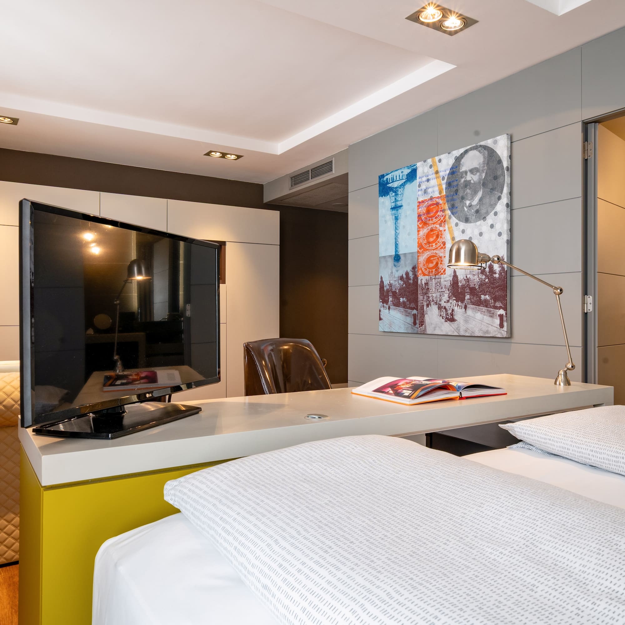 a room with a bed and a tv