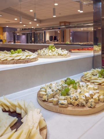 a group of cheese platters on a counter
