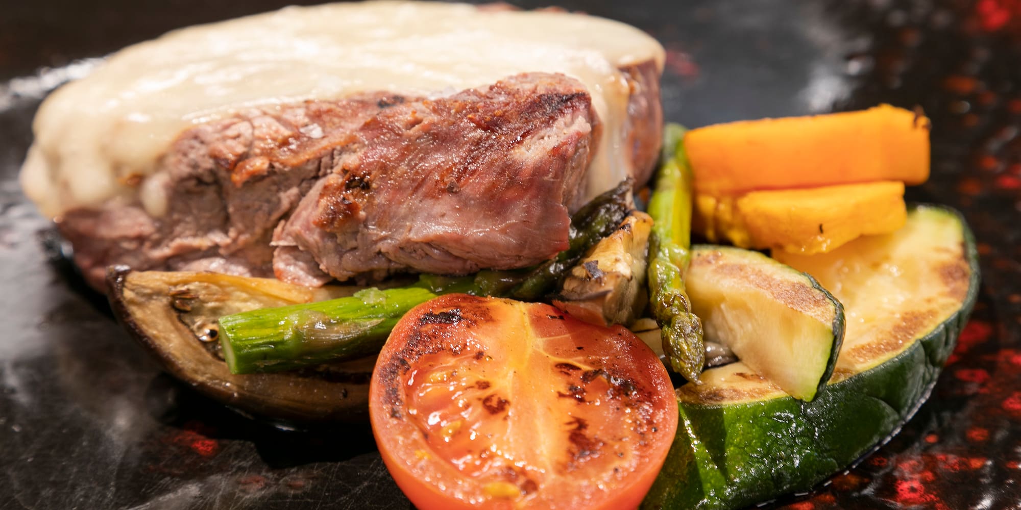 a plate of food with meat and vegetables